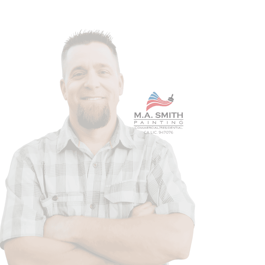 Smiling man with arms crossed beside the M.A. Smith Painting commercial and residential logo.